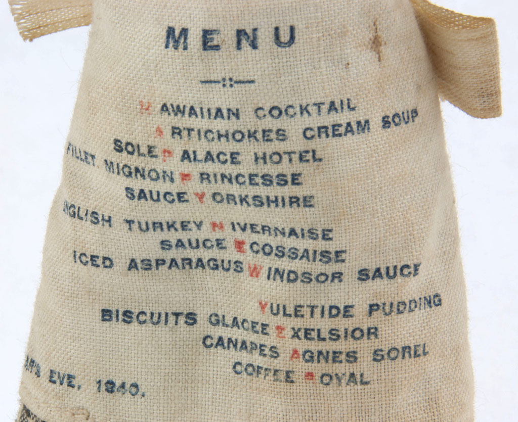 Close-up of the menu printed on the chef's apron